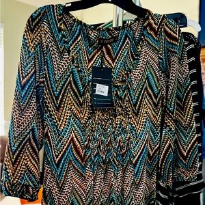 Smocked upper bodice, knee length, elbow sleeved dress.